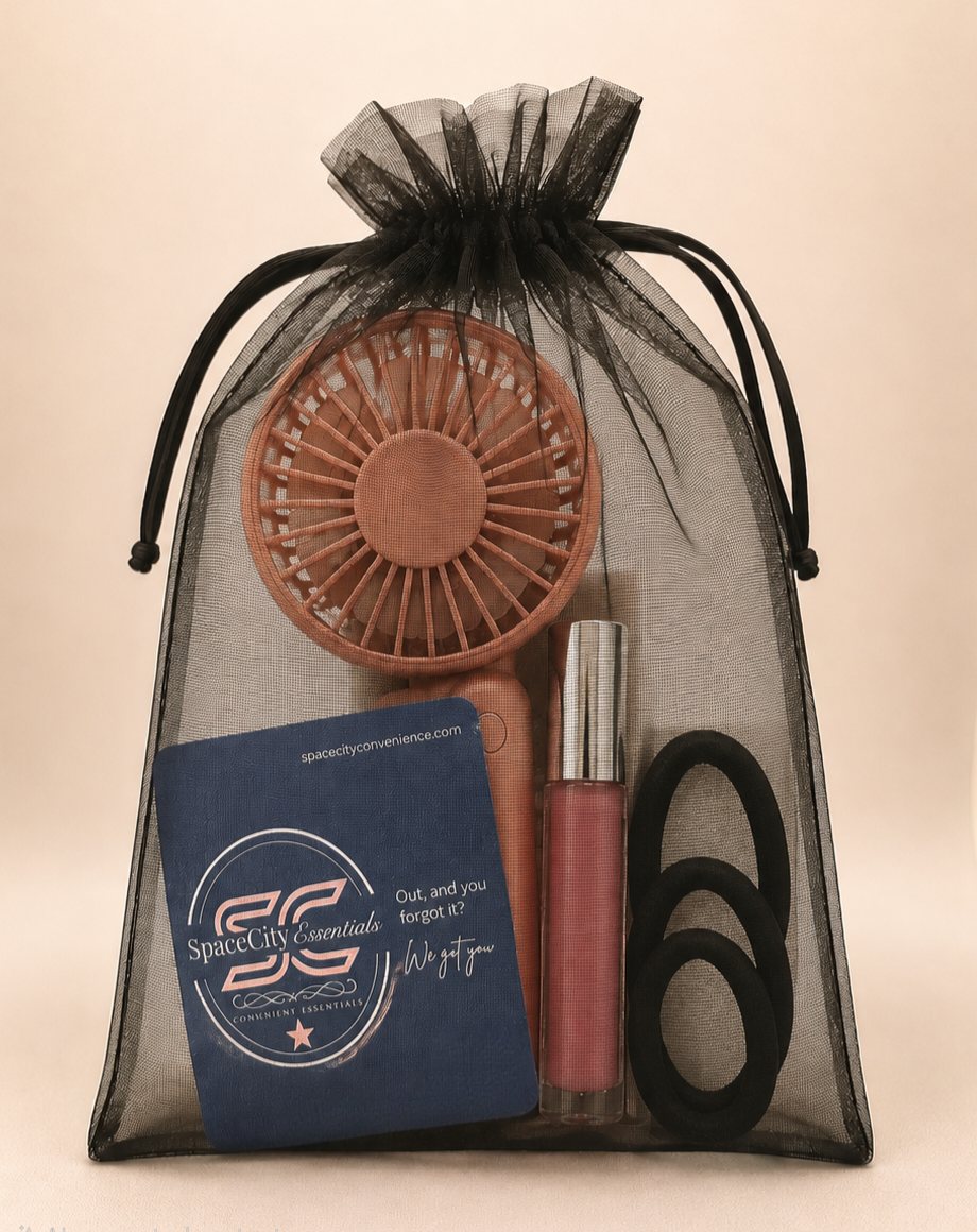 A SpaceCity Essentials pouch holding a mini fan, lip gloss, and hair ties